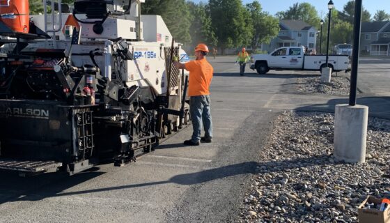 HMA employee working on a paving project