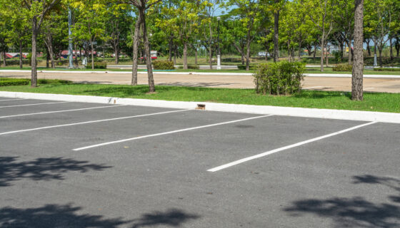 Photo of parking lot with empty spaces