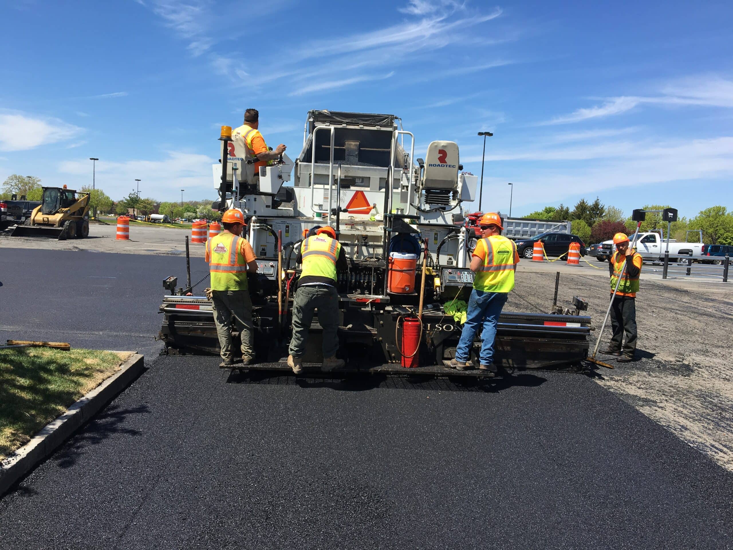 HMA employees working on a parking lot paving project